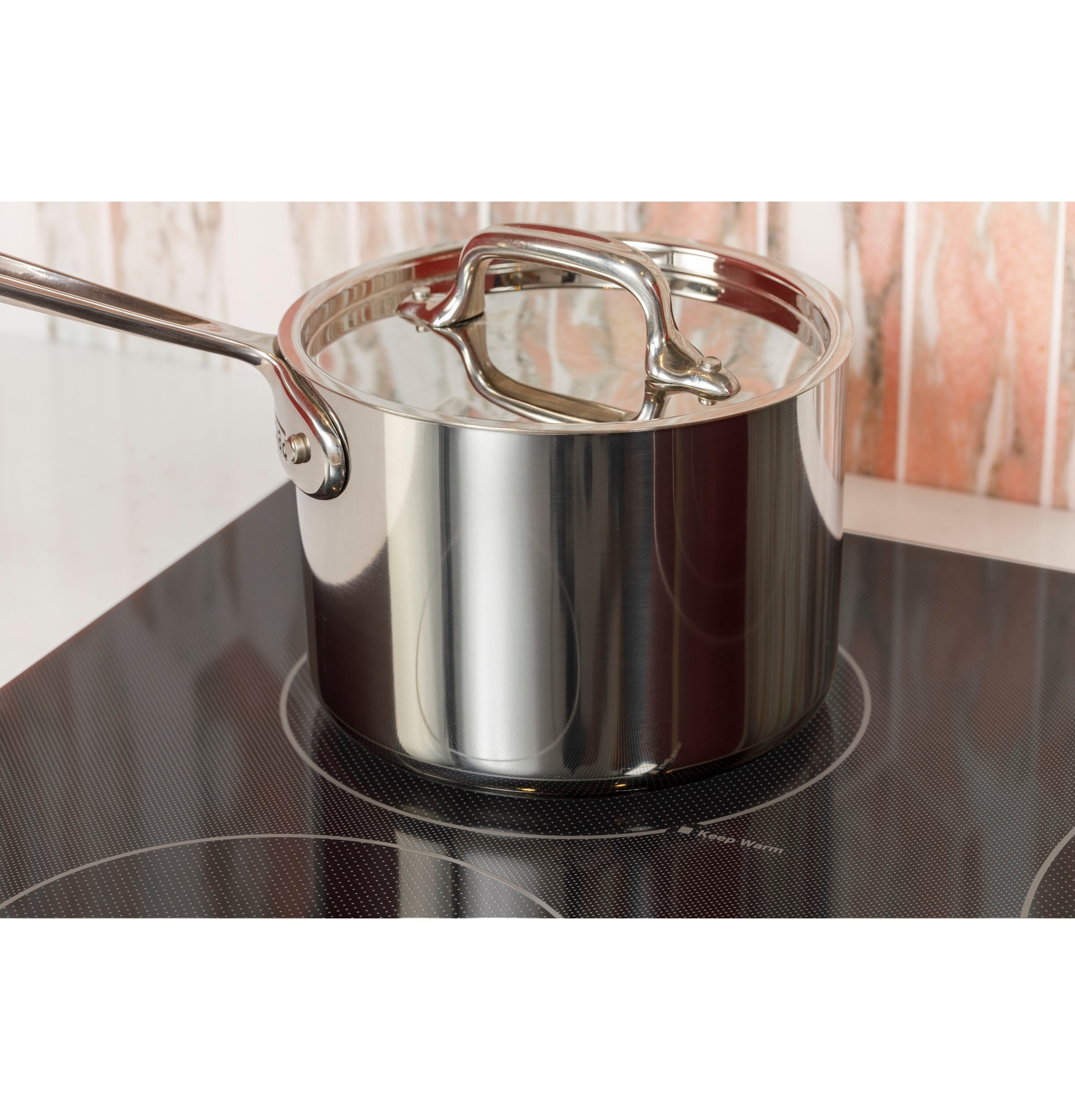 GE - 29.7 Inch Electric Cooktop in Black Stainless - JEP5030DTBB