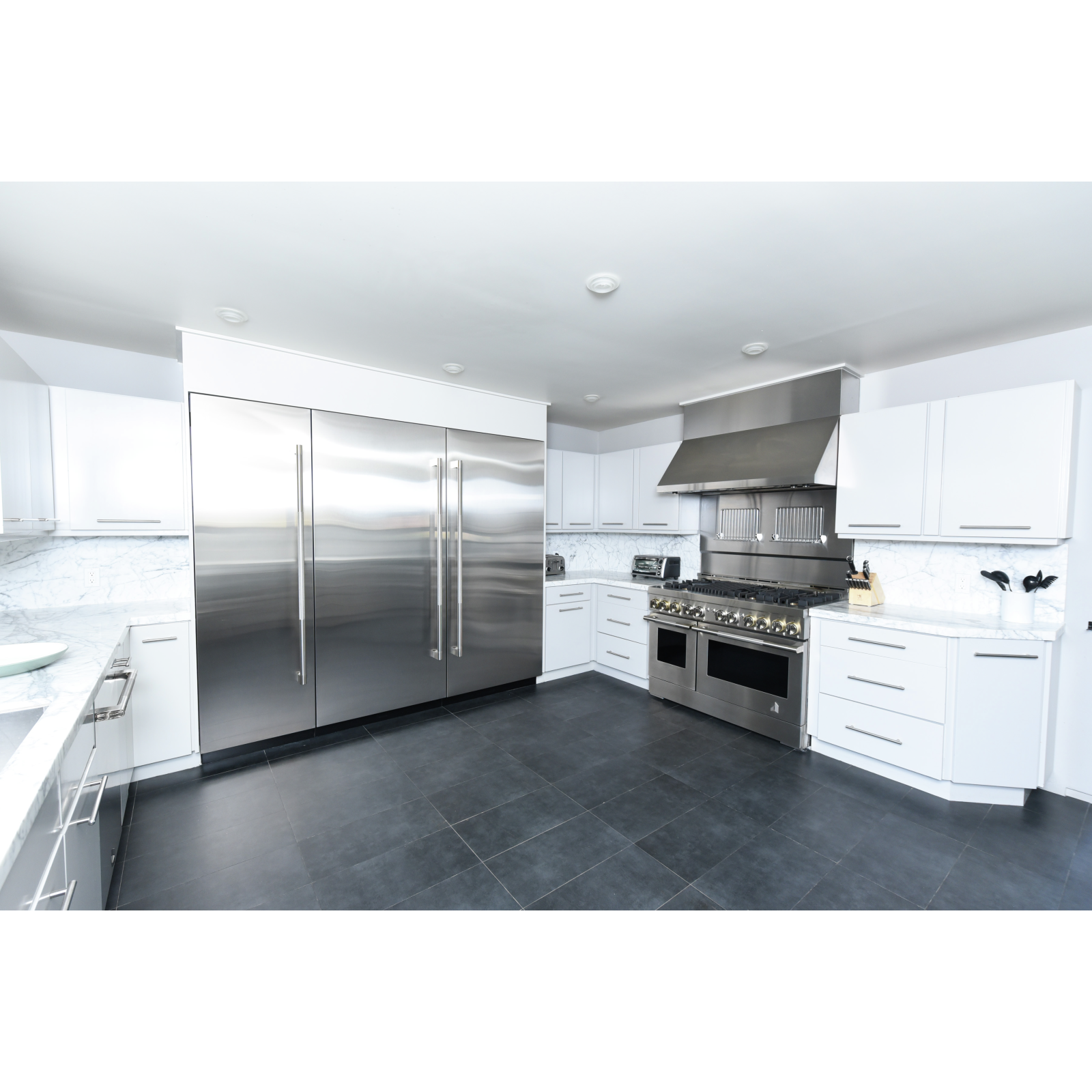 JennAir - 48 Inch 1200 CFM Wall Mount and Chimney Range Vent in Stainless - JXW9048HP